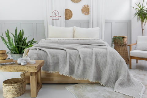 Organic cotton muslin quilt on a bed